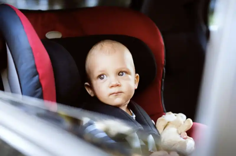 traveling toddler in carseat