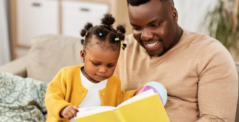 Dad reads to daughter