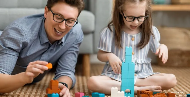 dad and daughter with legos
